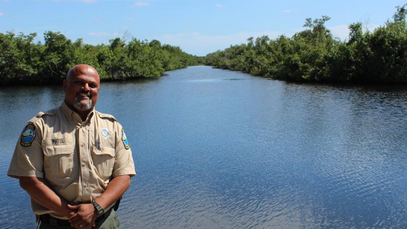 Maulik Patel stands on the seawall at Collier-Seminole State Park.